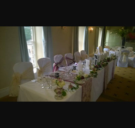 Champagne flocked sashes on white chair covers at Ripley Castle