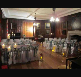 Teal organza and Champagne flocked double sash on white chair covers at Ripley Castle
