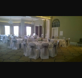 Taupe sashes on white chair covers at Rudding Park