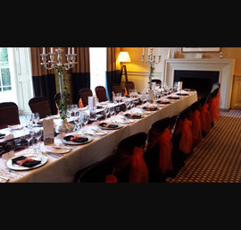 Orange Organza sashes on Black Chair Covers at Rudding Park, Harrogate