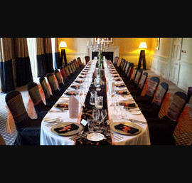Orange Organza sashes on Black Chair Covers at Rudding Park, Harrogate