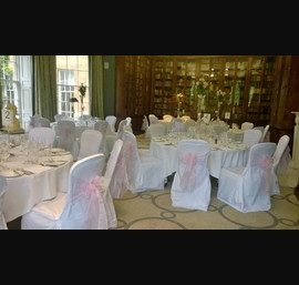 Baby pink Organza sashes on White Chair Covers at Rudding Park, Harrogate