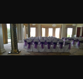 Cadbury Purple Organza sashes on White Chair Covers at Rudding Park, Harrogate