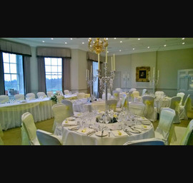 Yellow Organza sashes on white chair covers at Rudding Park, Harrogate