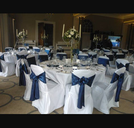 Blue Satin sashes on White Chair Covers at Rudding Park, Harrogate