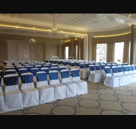 Blue Satin sashes on White Chair Covers at Rudding Park, Harrogate
