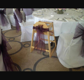 Aubergine organza sash on high chair at Rudding Park