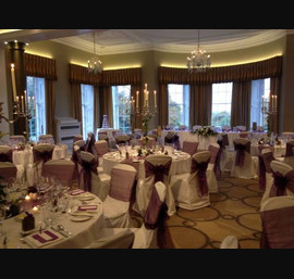 Cadbury purple Organza sashes on White Chair Covers at Rudding Park, Harrogate