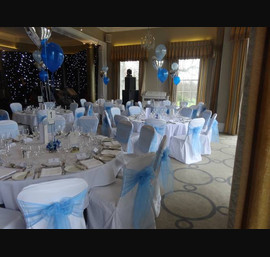 Cornflower blue organza sashes on white chair covers at Rudding Park