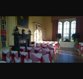 Burgundy Organza sashes on white chair covers at Swinton Park