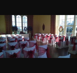 Burgundy Organza sashes on white chair covers at Swinton Park