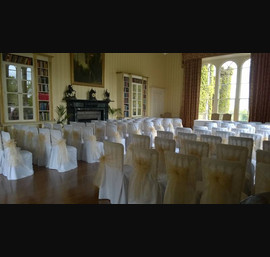 Ivory Organza sashes on white chair covers at Swinton Park
