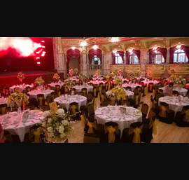 Yellow Organza sashes on black chair covers at the Vive le Tour dinner, Royal Hall, Harrogate