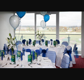 Electric Blue Sashes on white chair covers.Wetherby Racecourse Hospitality Suite, 60th birthday celebrations