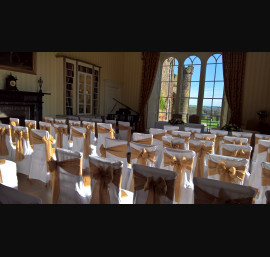 Hessian sashes on white chair covers at Swinton Park