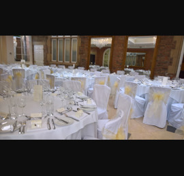 Champagne Organza sashes on white chair covers at Goldsborough Hall