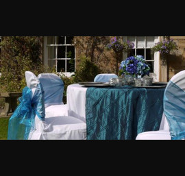 Teal organza bow with teal pintuck taffeta table runner