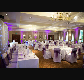 Purple Sashes on White Chair Covers at Norwood Hall (photo courtesy of Janie Barclay)