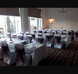 Black and Rust Sashes on White Chair Covers at The Caledonian, by Thistle