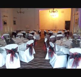 Black and Rust Sashes on White Chair Covers at The Caledonian, by Thistle