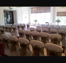 Bronze Sashes on White Chair Covers at The Caledonian, by Thistle