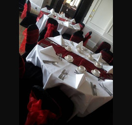 Red Sashes on Black Chair Covers at the Caldonian, by Thistle