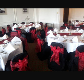 Red Sashes on Black Chair Covers at The Caledonian, by Thistle