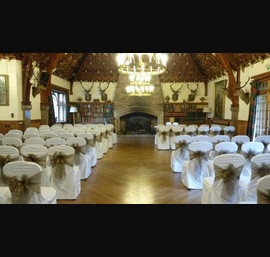 Bronze Sashes on White Chair Covers at Glen Tanar