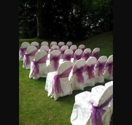 Pink/Purple Sashes on hotel's own chair covers at Norwood Hall