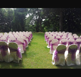 Pink/Purple Sashes on hotel's own chair covers at Norwood Hall