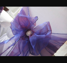Purple Sashes on White Chair Covers at the Old Mill Inn