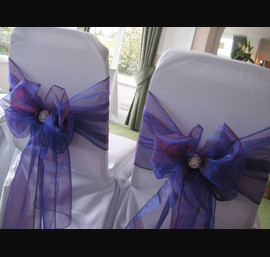 Purple Sashes on White Chair Covers at the Old Mill Inn