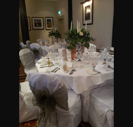 Olive Sashes on White Chair Covers at Pittodrie House Hotel