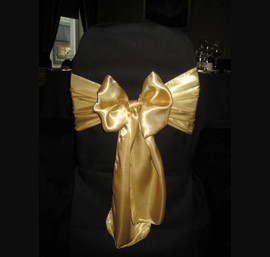 Gold Sashes on Black Chair Covers at Rox Hotel