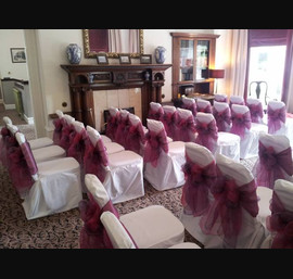 Fuscia and Heather Sashes on White Chair Covers at Tor Na Coille