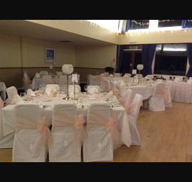 Dusky pink and champagne double side bows on white chair cover at Park Hotel, Montrose.
