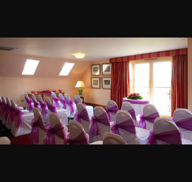 Cadbury purple single side bow on white chair cover at Carnoustie Golf Hotel