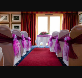 Cadbury purple single side bow on white chair cover at Carnoustie Golf Hotel
