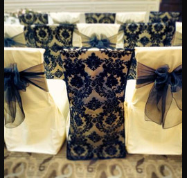 Navy damask chair veil alternated with navy single bow on ivory chair cover