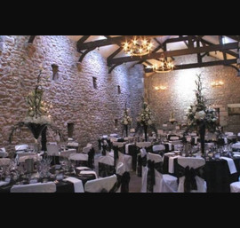 Black bow on white chair covers