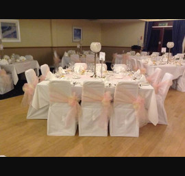 Dusky pink and champagne double side bows on white chair cover