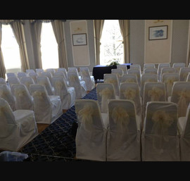 Ivory single bow on white chair cover