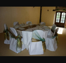 Sage green and bronze double side bow on white chair cover