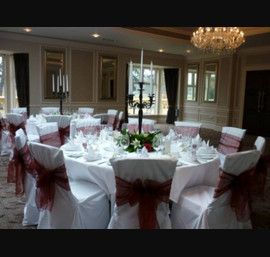 Burgundy single bow on white chair cover