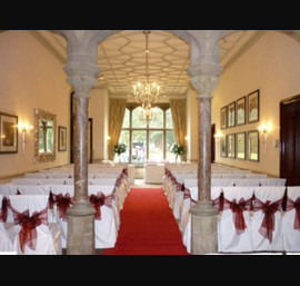 Deep red single bow on white chair cover