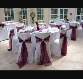 Bow organza sash tied with pearls on white chair cover