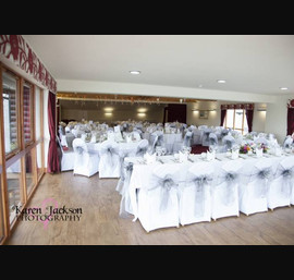 Silver single bow on white chair cover at Forbes of Kingennie