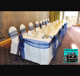 Navy single bow with matching swags and bows on white table cloth at Rufflets Hotel