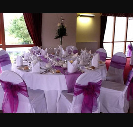 Cadbury purple single bow on white chair cover at Forbes of Kingennie