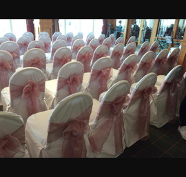 Sand chocolate single bow on white chair cover at Carnoustie golf hotel
